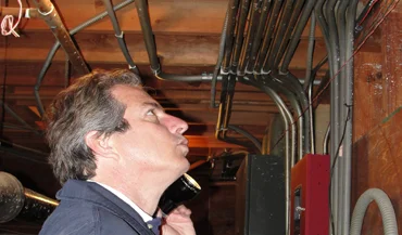 A pest control expert examining a home basement