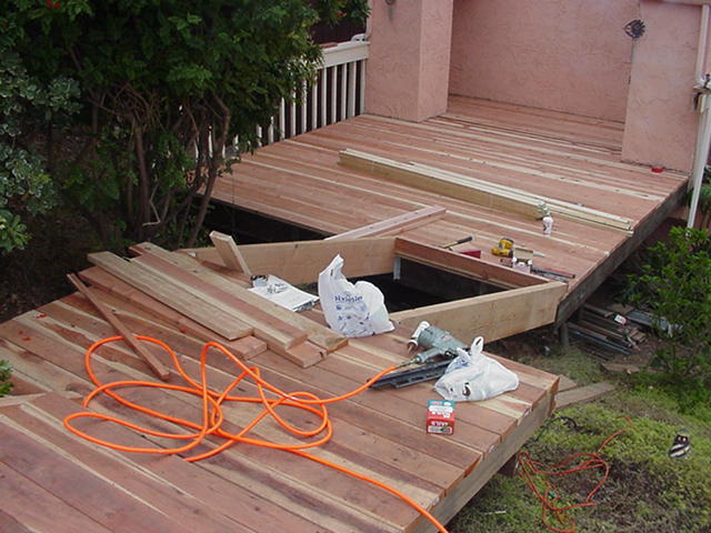 A residential deck taken half-apart